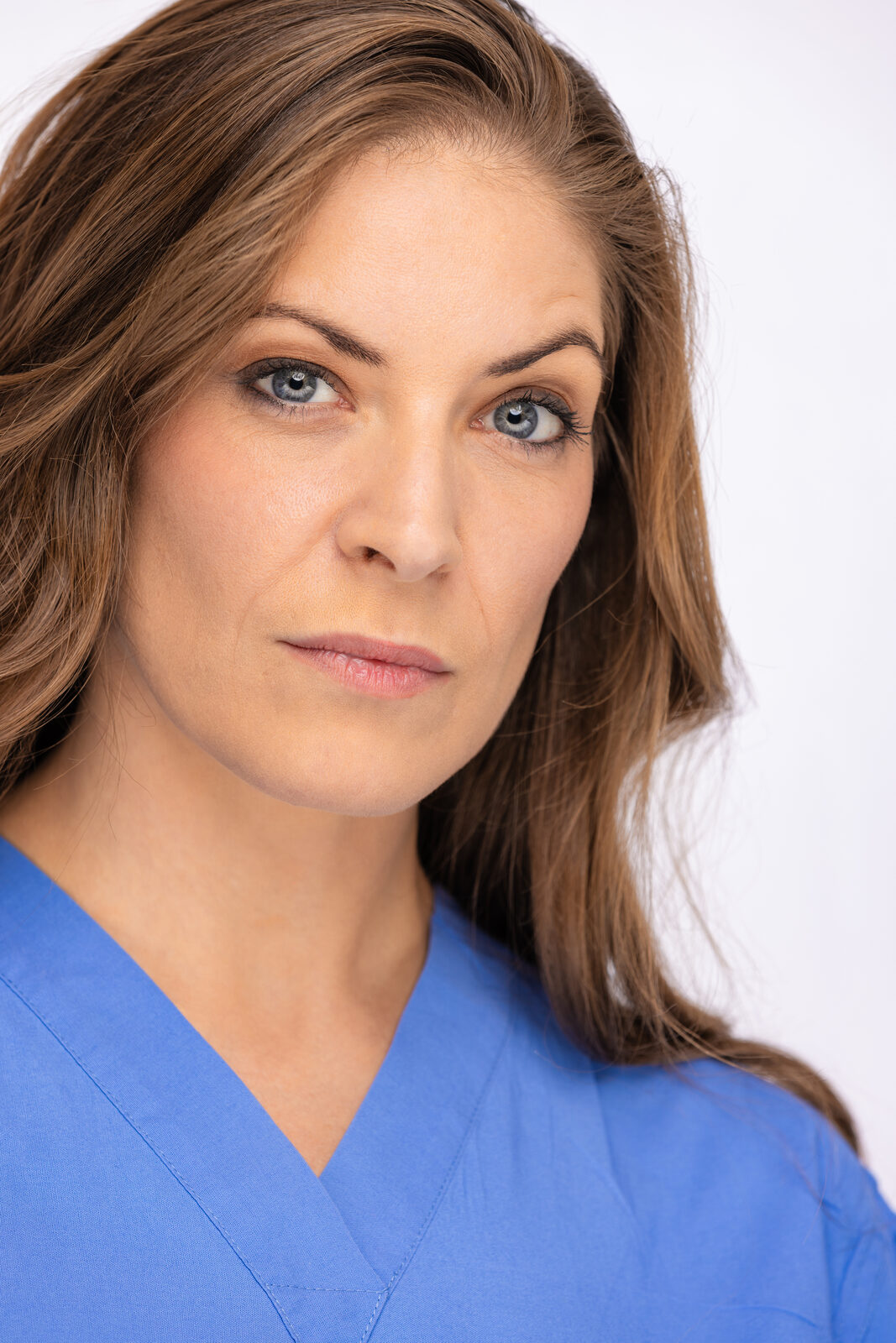 Actor headshot of Cat in medical scrubs