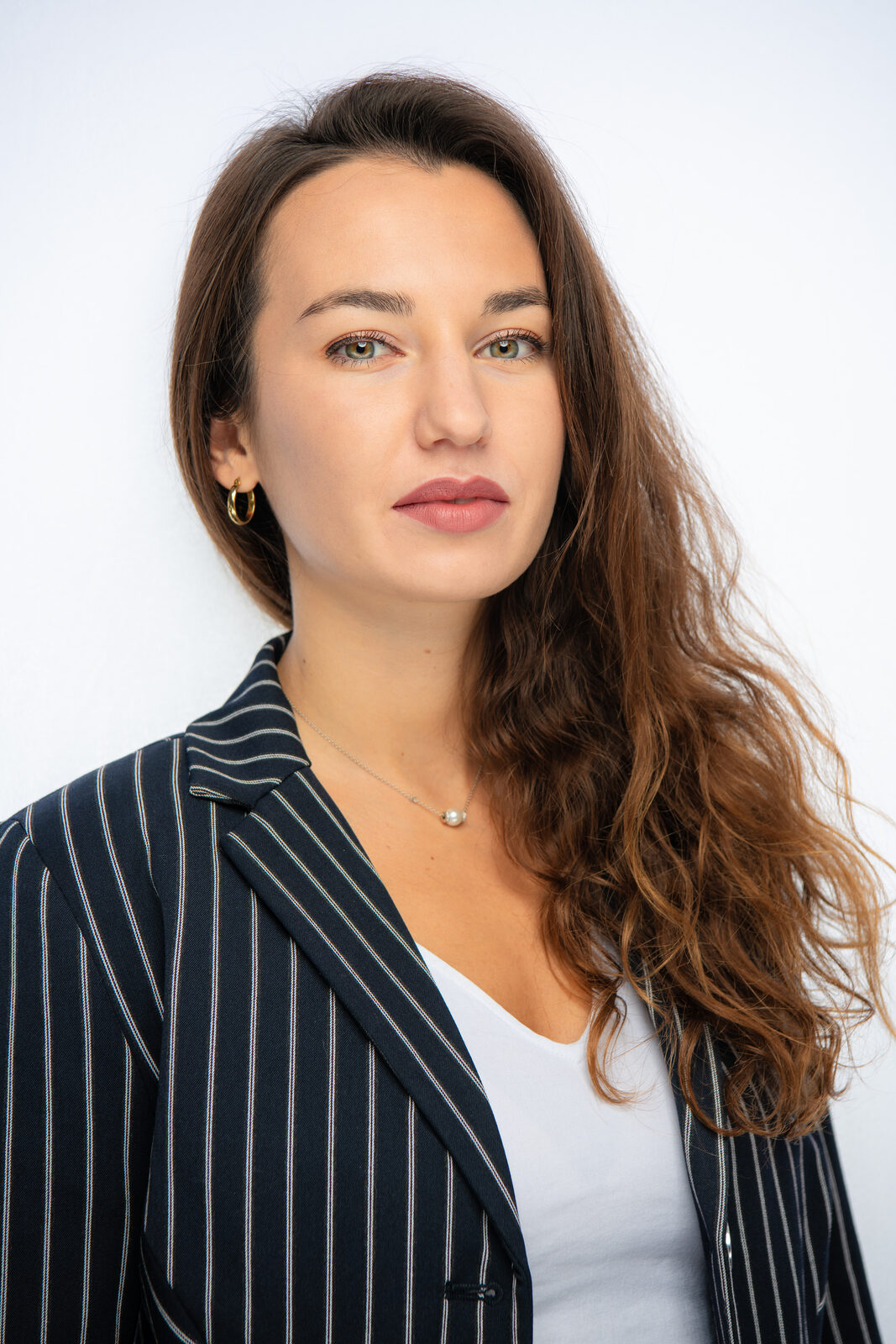 Actor headshot of Marie in a pinstripe blazer