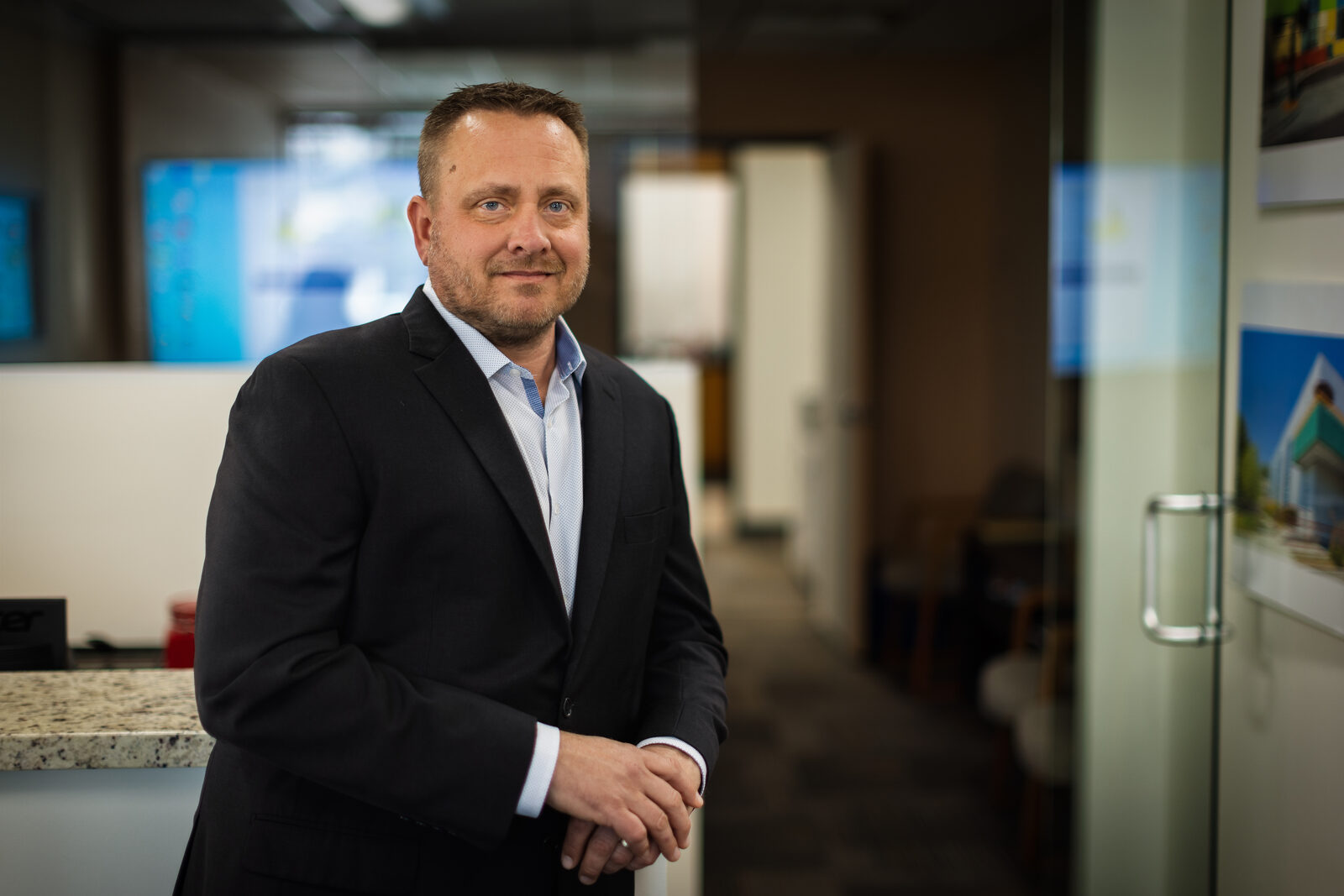Environmental headshot of an executive in his office